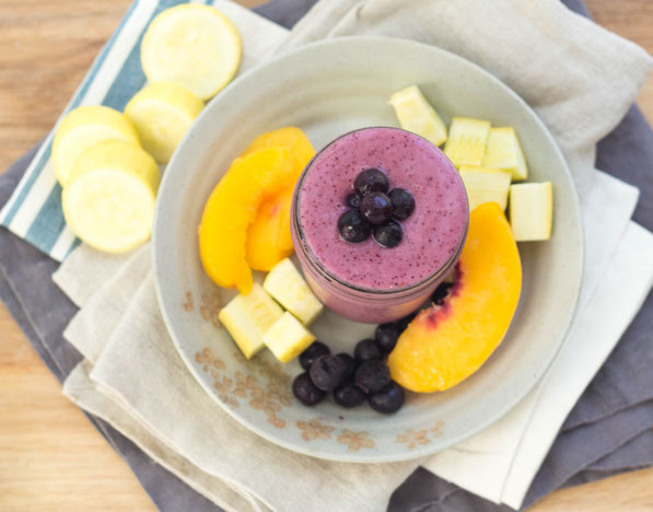 This creamy chocolate peanut butter smoothie with zucchini is a healthy way to start the day with a serving of veggies!  This recipe is gluten free, vegetarian, and absolutely delicious! Yellow squash blends into this blueberry-peach smoothie beautifully!