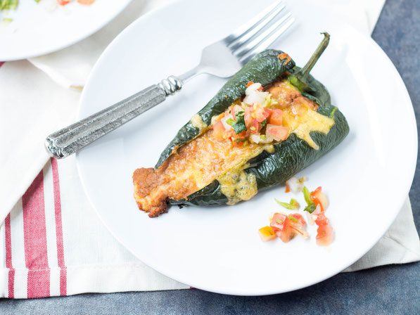 These easy vegetarian roasted poblano peppers stuffed with beans and cheese are a lighter twist on traditional chile rellenos.  They have only five ingredients and are ready in about 30 minutes!  Perfect gluten free weeknight dinner!