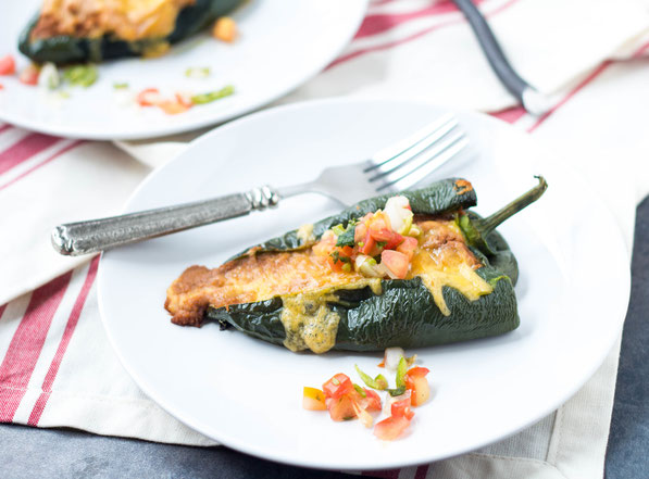 These easy vegetarian roasted poblano peppers stuffed with beans and cheese are a lighter twist on traditional chile rellenos.  They have only five ingredients and are ready in about 30 minutes!  Perfect gluten free weeknight dinner!