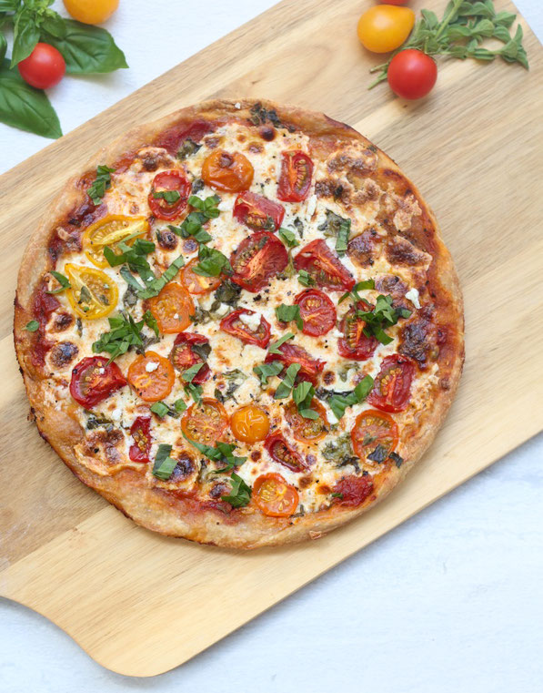 This light and healthy tomato and cheese skillet pizza is the perfect family-friendly vegetarian dinner recipe!
