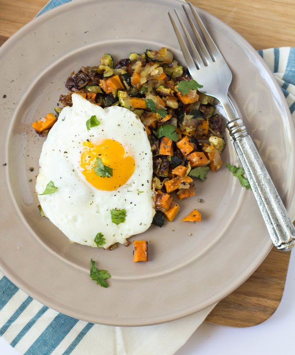 This simple, delicious seven-ingredient vegetarian roasted veggie hash with eggs is the perfect healthy breakfast-for-dinner recipe!