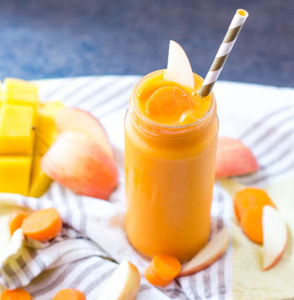 This vegan carrot, mango, and ginger smoothie is packed with vitamins, minerals and fiber.  It's a great way to add a refreshing boost of nutrition to a busy morning! 