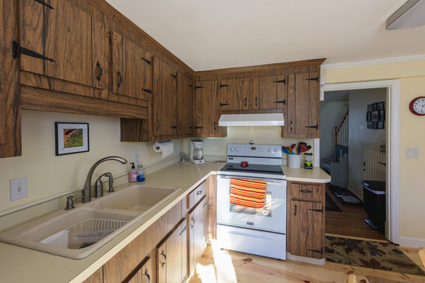 Kitchen fully appointed including 22 CF bottom freezer ice maker, self cleaning stove and washer dryer laundry closet.         