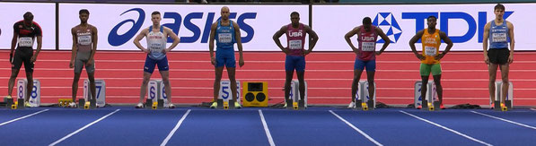 Adam Thomas (lane 6) lines up for the start of the 60m final next to winner Lamont Jacobs