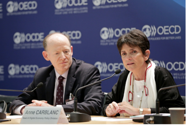 OECD officials Andrew Wickoff and Anne Carblanc speak at a press conference about the principles on AI in Paris on May 22, 2019. Photo by OECD/Hervé Cortinat