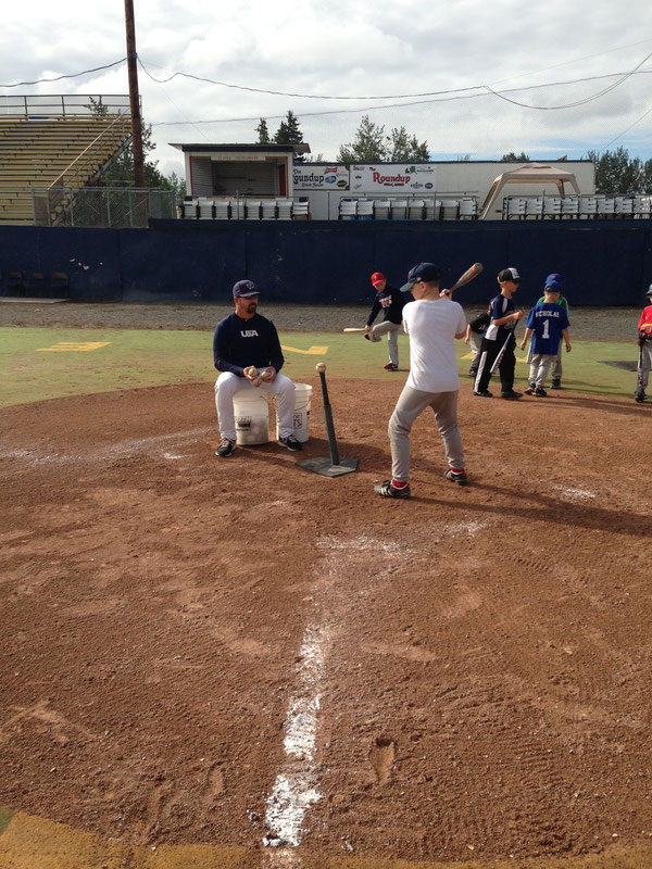 Rob Shabansky Head Coach Gateway Community College in Phoenix Arizona working with a camper at Goldpanner Park Fairbanks Alaska July 2013