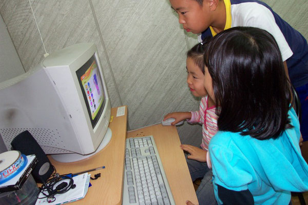 Having fun using our computer room for learning English.