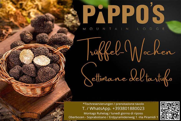 Trüffelwochen im Pippo’s Mountain Lodge in Oberbozen am Ritten mit frischen schwarzen Trüffeln im Korb und kulinarischen Spezialitäten rund um den Edelpilz.
