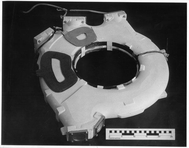  35 MeV betatron donut - Black and white photograph of 35 MeV betatron donut. Showing electron exit beam “pancake” deflector coils - H20 x L26 x D 1mm