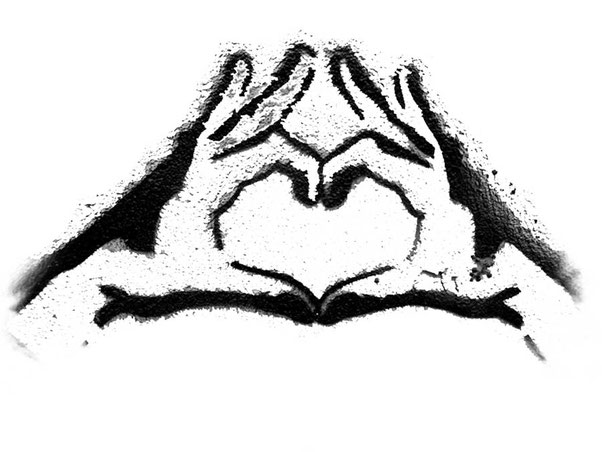 photo of romantic graffiti - hands in the shape of a heart