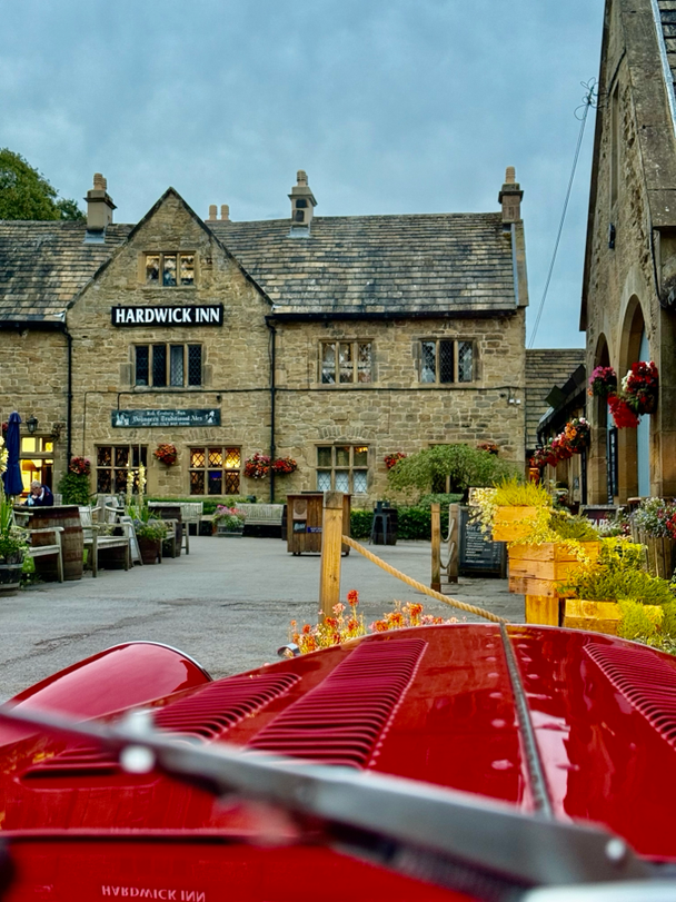 Old car in front of a famous pub