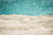 The turquoise water of Víti behind a dirty snow cornice