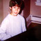 Nicholas playing the piano, around 2000. CREDIT: NJB