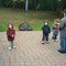 Nicholas and his three little disciples, Frankie and twins Kyle & Brendan Engel, football lessons. Bonus cuteness points for each sibling set wearing matching clothes! Credit Lisa Engel!