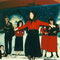 Christmas party at CFNI, Denise singing in the back and tiny tot Kevin sitting on stage.
