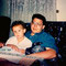 Sweet capture of Nicholas in his father's lap + a little girl lost in the shadows to the left. CREDIT: originally shared by Nick, HEAVILY EDITED by the NJB team!