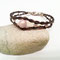 Außergewöhnliches Armband mit großer Perle in rosa sowie kleinen silbernen Perlen in Herzform