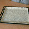 prepared pizza dough on baking tray