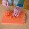 cutting peeled tomato