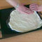 pulling dough on baking tray