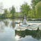 Brautpaar am Ruderboot am Hücker Moor · Hochzeitsfotografie OWL · romantische & ruhige Szenen
