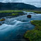 At the river Fróða. For just 7km we needed 4 hours and finally camped in Fremri Fróðárdalur to wait again 24h for less rain. The horizontal lines on the hillsides mark former water levels of Hvítárvatn.