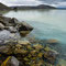 Scrambling over rocks at the lakeside.