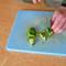 cutting a small part of zucchini in small strips