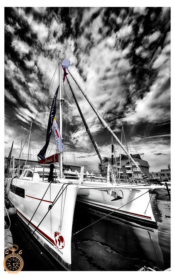 Waves against a fantastic sunsetSailboat in black white against a strong sky, Color Touch Effects