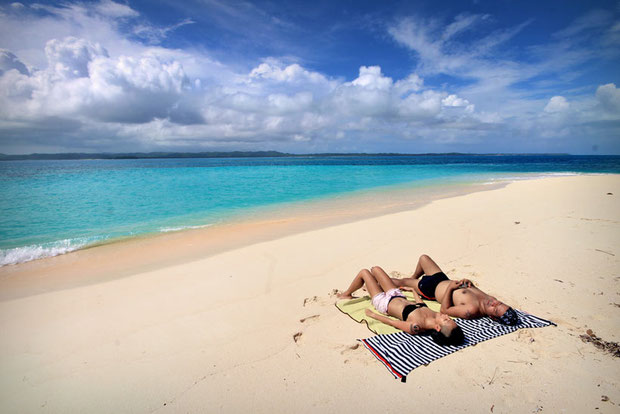 Gay of Pinaytraveljunkie.com and Ron of Fliptravels.com are beach bummers... Siargao, Philippines © Sabrina Iovino | via @Just1WayTicket