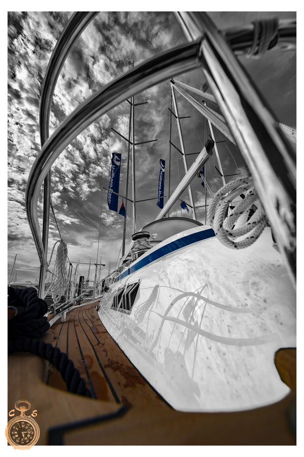 Waves against a fantastic sunsetSailboat in black white against a strong sky, Color Touch Effects