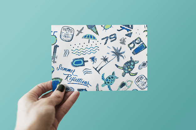 hand holding card with colourful print
