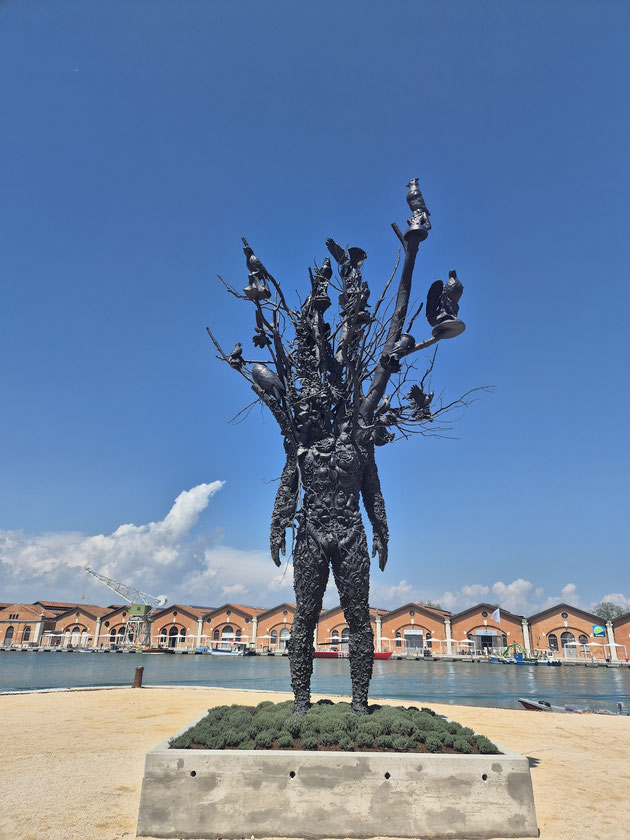 A detailed close-up of Nick Cave's bronze sculpture Amalgam (Origin) (2026), blending human and natural forms, on display at the 61st Venice Art Biennale curated by Koyo Kouoh.