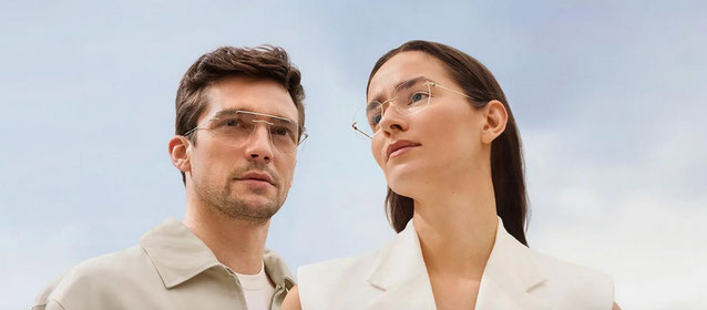 Mann und Frau mit randlosen Silhouette Brillen