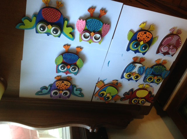 Happy little owls cut out on a laser and hand painted.