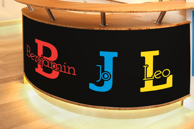 Benjamin, Jo and Leo customisable vinyl decal name on the bottom of a wooden kitchen counter. More colour options are available from www.wallartcompany.co.uk