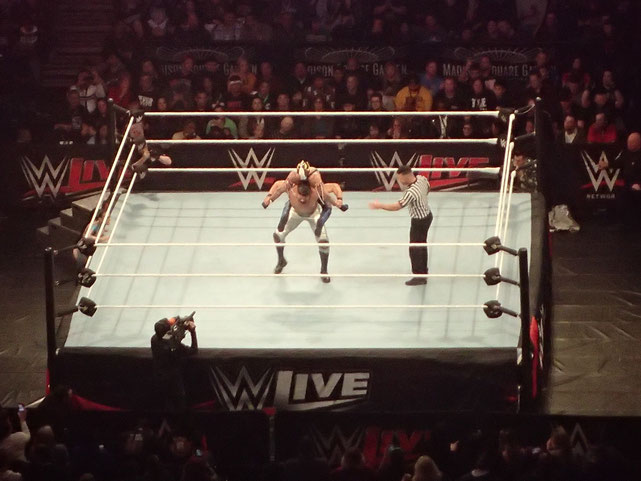Andrade Puts Mysterio in a Submission Hold