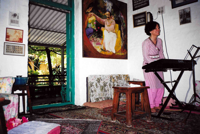 Bobbi playing the keyboard in Meherazad's Mandali Hall, 1984