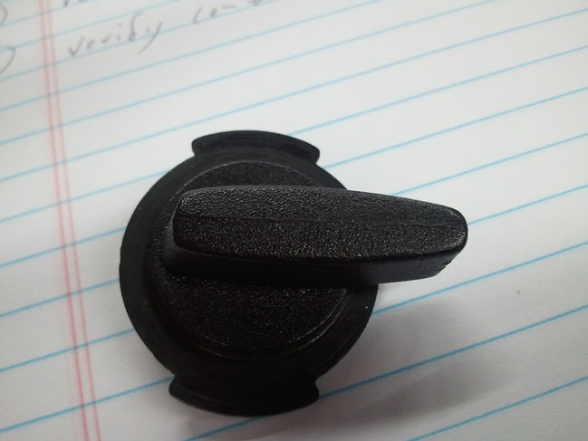 A plastic knob from a magnetic indicator mount. It costs more to buy one of these than it does to just purchase another cheap indicator mount.
