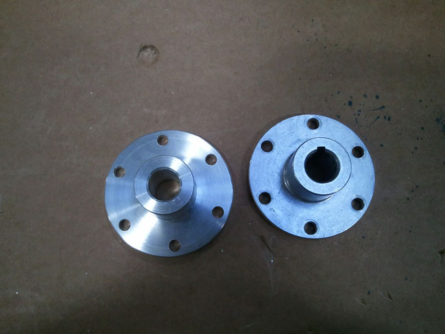 The hub on the right was affordable but had a two week lead time from a robotics supply company. The Hub on the left was machined in about two hours on a manual lathe and mill. The keyway was not required so it was not replicated.