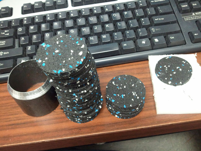 The rubber is from Rubbercal and is recycled tires made into a mat material. The rubber company wanted $400 for 24ea 2" round pieces. Instead, we ordered an uncut length then made a die from a piece of pipe and made our own.