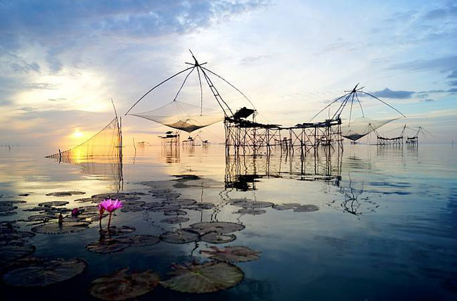 Sunrise over the iconic yor yak—stilted fishing platforms