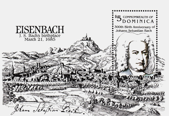 Ein schwarzweißer Briefmarken-Block aus Dominica. Es ist ein historischer Holzstich von der Stadt Eisenach. Rechts ist eine Briefmarke mit dem Porträt von Bach. Links ist eine große Headline mit einem Fehler. Dort steht nämlich EISENBACH.