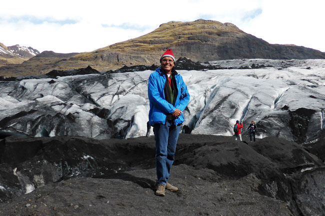Standing in front of Sólheimajökull Glacier, in Iceland 