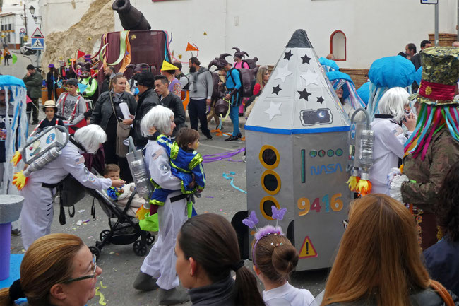 Female NASA astronauts, with rocket backpacks and space children