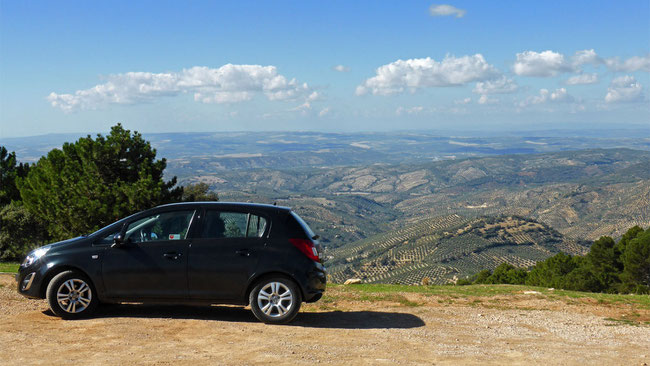 Our hire car, and the view of olive groves  disappearing over the horizon, in Parque Natural Sierras de Cazorla, Segura y las Villas – you can’t get here on Public transport!