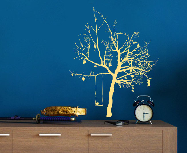 Option 5 Wish Tree, cream coloured detailed branched tree with shoes and a swing with a squirrel on a blue wall in a living room.