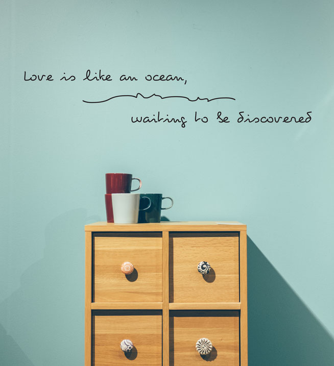 Love is like an ocean waiting to be discovered from www.wallartcompany.co.uk comes in loads of colours. Hand drawn style love quote, with a cute wave and text under the sea.