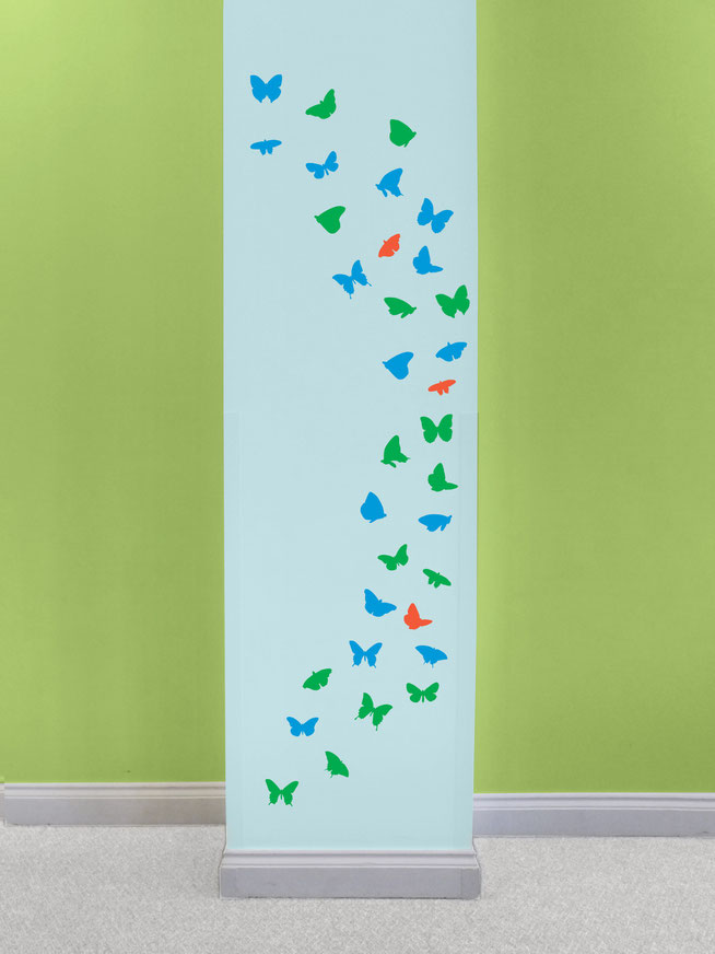 A flock of butterflies with detailed wings pictured in a bedroom. These are a versitle wall art design and the butterflies can be placed almost anywhere. A collection of different sizes will add a new element to a wall. Great for school books.