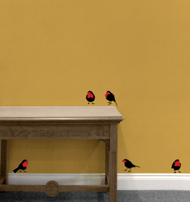 Five black Robins birds with red chests placed around a entry hall way, each can be placed in a different spot waiting for someone to find them hiding creating a unique design feature to your home. 